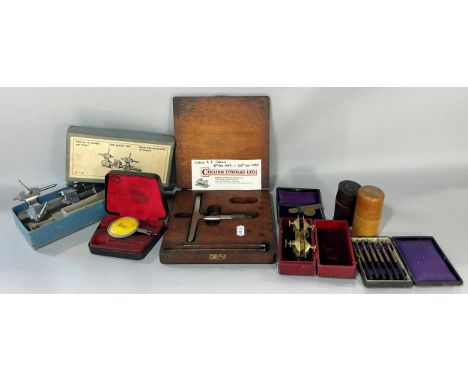 A collection of watch makers instruments including a small precision lathe with further associated tools 