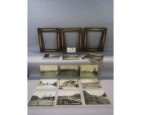 Three mother-of-pearl inlaid picture frames, a green painted sunburst convex mirror, a henna decorated wall light shade, a se