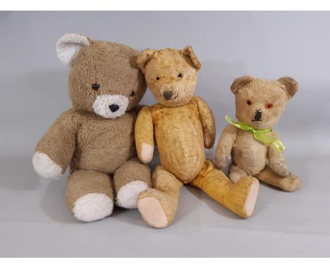 3 vintage teddy bears including a bear with short golden plush, stitched nose, mouth and claws, cloth/card paw pads, short ar