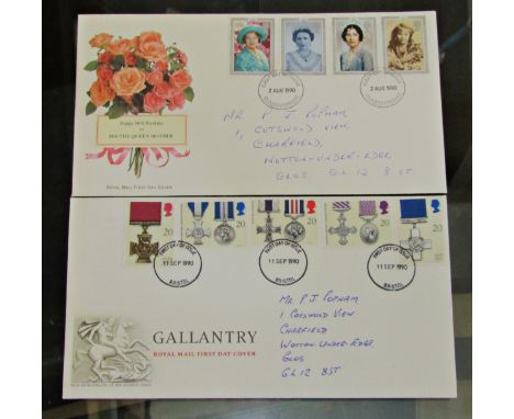 Two albums of first day covers from the mid 1960s to the early 90s, period and a card of shell historic car medallions 