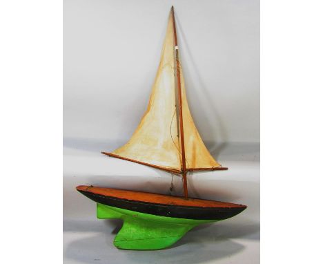 A vintage single mast pond yacht named Britannia 55cm long. 