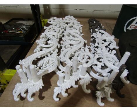 Architectural Salvage Interest - A group of twelve painted cast iron scrolling stairway mounts, each measuring 94cm long appr