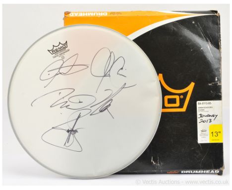 Remo Autographed Drumhead signed by members of the rock band Journey in 2013 - generally Very Good Plus. An interesting item.