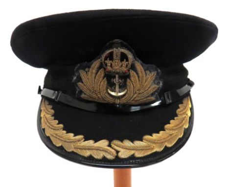 Post 1901 Royal Navy Commander Service Dress Capblack crown and body.   Black peak with gilt wire embroidery oak leaf single 