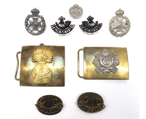 Small Selection Of Bermuda Regiment Badgesconsisting 2 x white metal cap badges ... 1 x white metal forage/collar badge ... 2