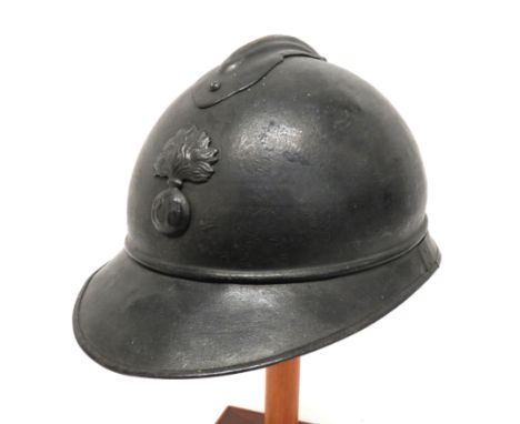 WW1 French Infantry Steel Helmetdark grey/black painted crown with comb.   Lower, two part brim.   Infantry flaming grenade b