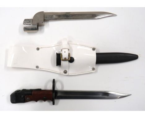British No 7 And No 9 BayonetNo 7 bayonet.   8 inch, single edged, clipped point blade with fuller.   Large, blackened muzzle