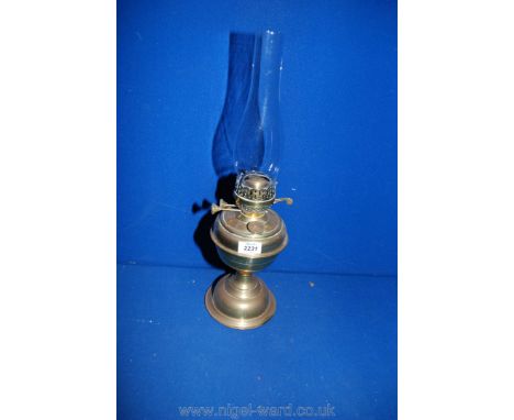 A brass oil lamp.