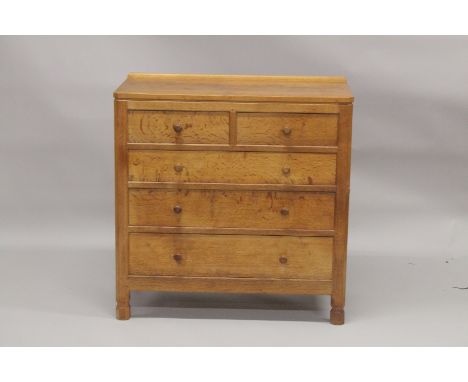 ROBERT "MOUSEMAN" THOMPSON. AN OAK  CHEST OF DRAWERS, with adzed rectangular top, panelled ends, two short and three long gra