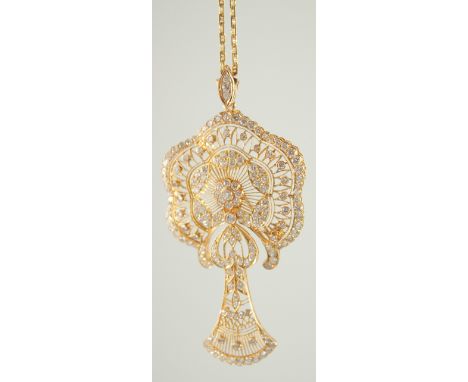 A SUPERB 18CT GOLD FILEGREE DIAMOND SET PENDANT AND CHAIN.
