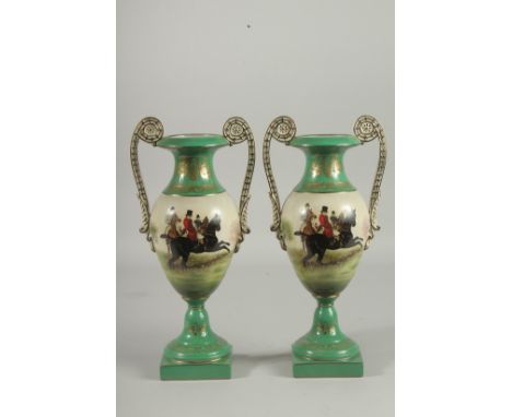 A PAIR OF SEVRES DESIGN TWO HANDLED GREEN HUNTING VASES. 13ins high.