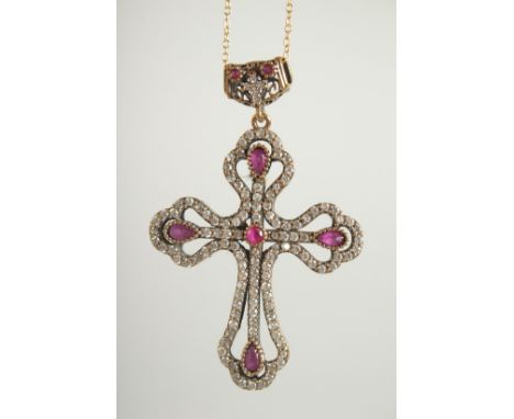 A SILVER GILT RUBY SET CROSS AND CHAIN.