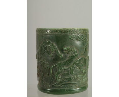 A CHINESE CARVED JADE CIRCULAR BRUSH POT. 5ins.