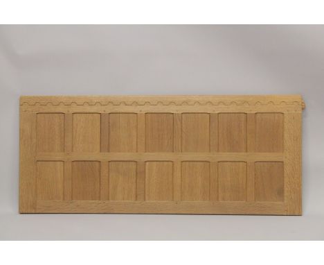 ROBERT "MOUSEMAN" THOMPSON. AN OAK  HEADBOARD with panelled back and pair of supports. 4ft 6ins wide x 1ft 10.5ins high.