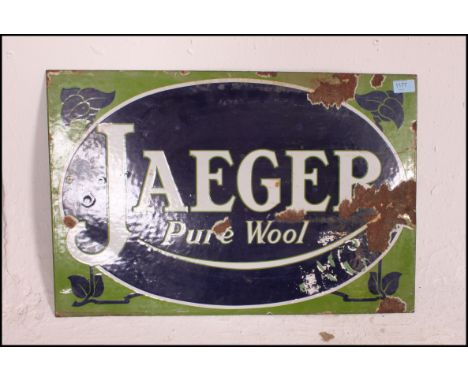 A fabulous early 20th century enamel advertising sign being twin sided with notation for Jaeger ' Pure Wool '. Retaining brig