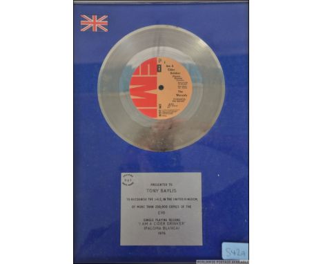 A framed, glazed and mounted Silver disc for The Wurzels ' I Am A Cider Drinker '. Presented to Tony Bayliss ( Bass player ) 