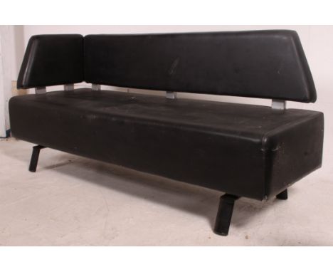 A 1970's retro black and chrome upholstered sofa settee with black vinyl seat and back rest with chrome flashwork