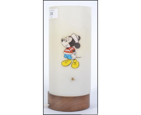 A retro children's bedside lamp having a circular full length shade having applied Disney's Goofy, Mickey Mouse and a Disney 