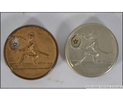 A pair of vintage mechanical whist markers, the tops cast in white metal and gilded metal having harlequins. The lids rotatin