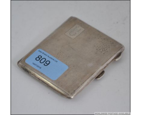 A silver hallmarked engine turned hallmarked cigarette / cheroot case, having assay mark for Birmingham, makers marks for May