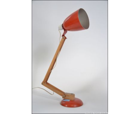 A Terence Conran ' Mac ' Lamp - anglepoise desk lamp circa 1950's - mid century having red shade with wooden arm and red base