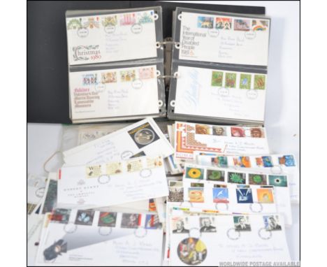 A large collection of vintage and contemporary First Day Covers FDC's - many within sleeves. Comprising of a quantity of loos