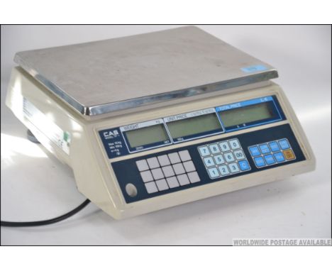 A pair of large electronic scales with digital read out previously used in an old sweet shop. Measures: 33cms wide.