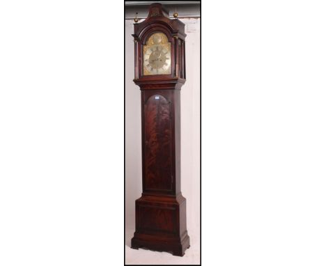 A 19th century mahogany longcase / grandfather clock with brass face by Gregory Sewell Senior of London. The flame mahogany c