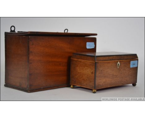 A 19th century mahogany inlaid tea caddy raised on ball finials together with a mahogany hanging wall box, circa 19th century