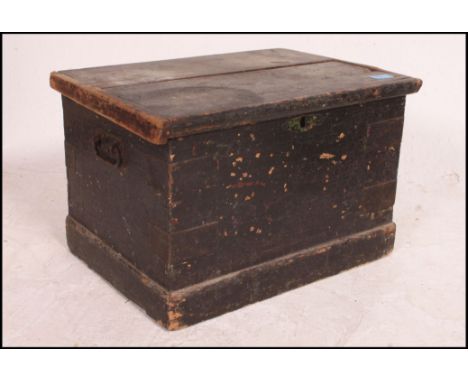 A vintage Victorian ebonised pine box with tools to include files, plough plane, scribes etc
