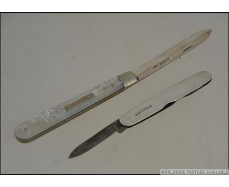 2 silver hallmarked fruit knives / pen knives, one with mother of pearl set handle. Hallmarks for Harrison Brothers & Howson 