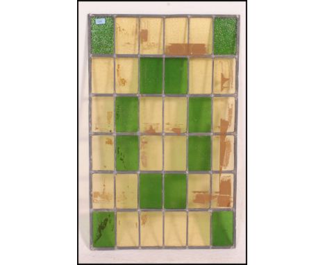 A large vintage 20th century stained glass leaded window panel consisting of various coloured glass panels. Measures: 99cm x 