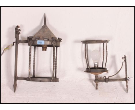 A pair of vintage cast metal architectural external hanging storm lights / lanterns, having spaces for glass panels, all in t