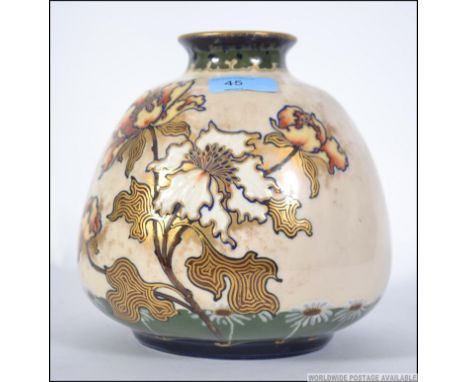 A Turn Vienna art nouveau style vase with white ground decorated with floral spray stamped to the base Turn Vienna. Measures: