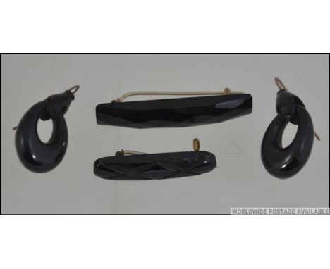 A collection of early 20th century vintage mourning jewellery to include 2 brooches likely of jet form together with a pair o