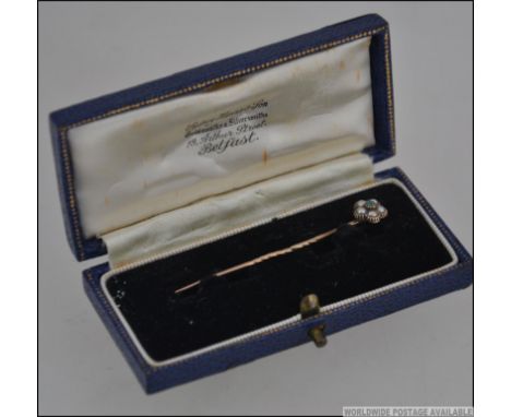 Gold stick / tie pin , unmarked tested as 9ct gold , in original box. Weighs approximately 1.1
