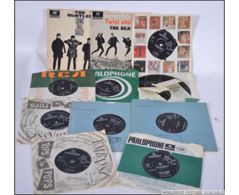 A collection of 45rpm Vinyl singles and EP records by The Beatles to include long Tall Sally and Twist And Shout both EP alon