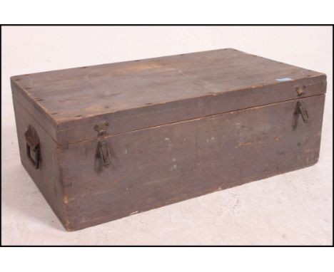 A wooden chest containing a large collection of tools and equipment to include planes, saw etc