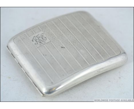 A silver engine turned large hallmarked cigarette case with monogram cartouche by Robert Pringle & Sons, Birmingham 1925. Wei