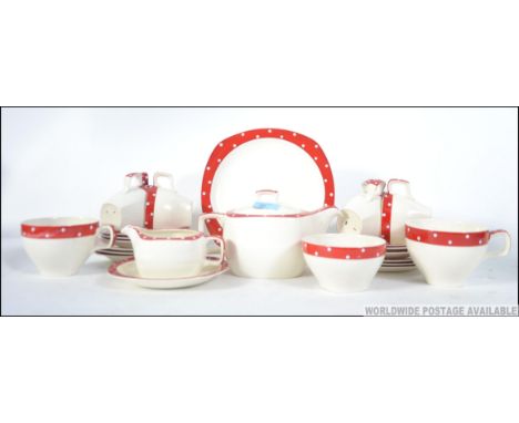 A stunning retro 1960's Midwinter stylecraft tea service in white and red polka dots comprising teapot, cups, saucers, creame