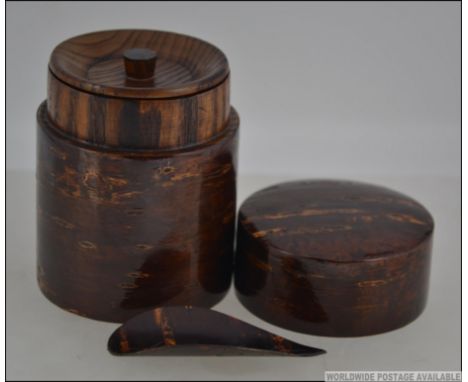 A 20th century cherry tree oriental tea caddy and spoon. Measures: 10cms high.
