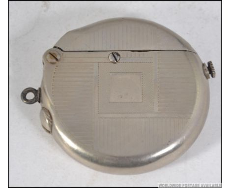 A 1930's Art Deco Thorens double claw cigarette lighter with chased case, square cartouche plain with hinged top; Measures: 6