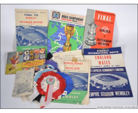 A collection of vintage 1960's football programmes and rosettes to include England V Wales, Chelsea V Spurs FA cup final with