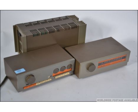 A vintage retro Quad 303  2-channel amplifier along with a Quad FM 3 tuner and a Quad 33 pre amp and tuner, with cables and w