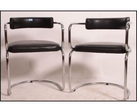 A matching pair of vintage Italian 20th century cantilever chrome and black dining chairs