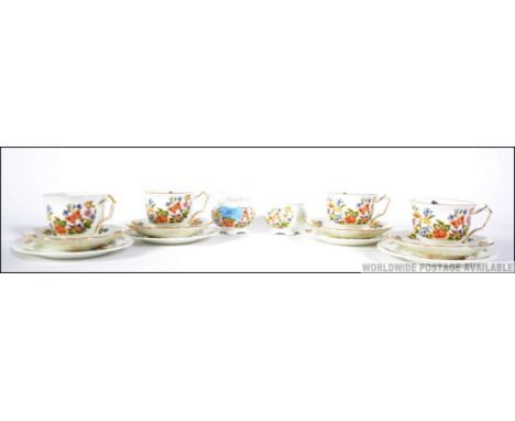 A vintage Aynsley china part tea service in a chintz pattern to include cups, saucers, plates etc