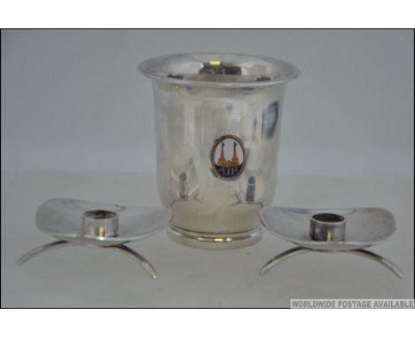 A Danish silver goblet with enamel set coat of arms together with a pair of Danish white metal fairy light / candle stands ma