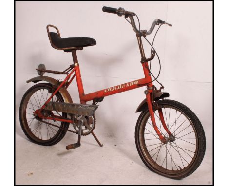 A vintage 1970's Raleigh Commando childs bicycle, very much ' Chopper ' inspired design. With original seat and tyres still f