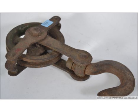 A 20th century Industrial pulley with wheel and hook, ideal as a lamp - light fixture fitting. 38cms long