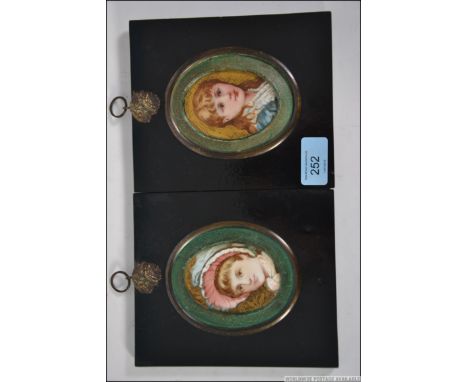 A pair of small portrait bust studies of young girls, both painted on ceramic plaques and set within ebonised frames.